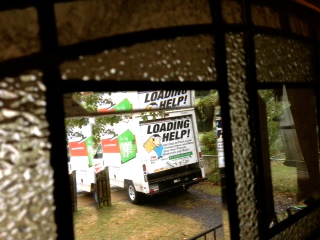 it was a very rainy moving day...  but this tiny truck did the job.