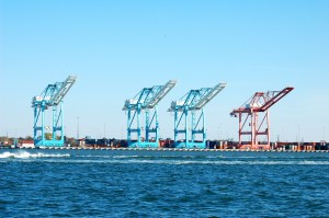 Big old cranes all lined up ready to load the cargo ships.