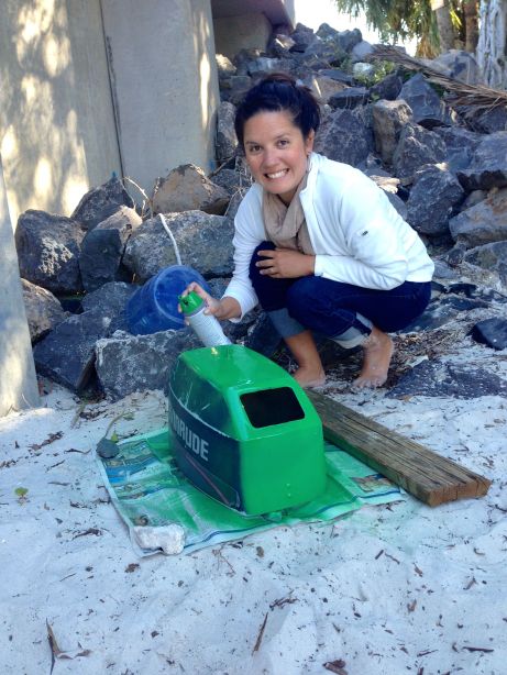 Here's me, at the Lake Worth dinghy dock, painting it green!  If you see a few green rocks there on your next stop, it's my fault :)
