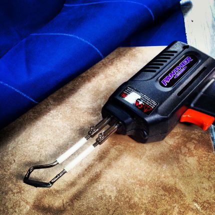 The awesome hot knife (I kinda' need one) and the canvas all marked up. I used the tile as my straight edge because my only big ruler is plastic! Why do we have a tile on board? That's another post!