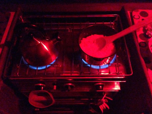 Cooking dinner with our red lights on.  Thanks Peg and David, we love our red lights :)