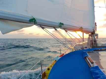 Our reefed mainsail at sunset