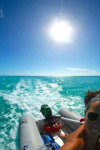 Our cute, little, hard bottom dink and 6 hp motor. Playing in Norman's Cay - February 2014