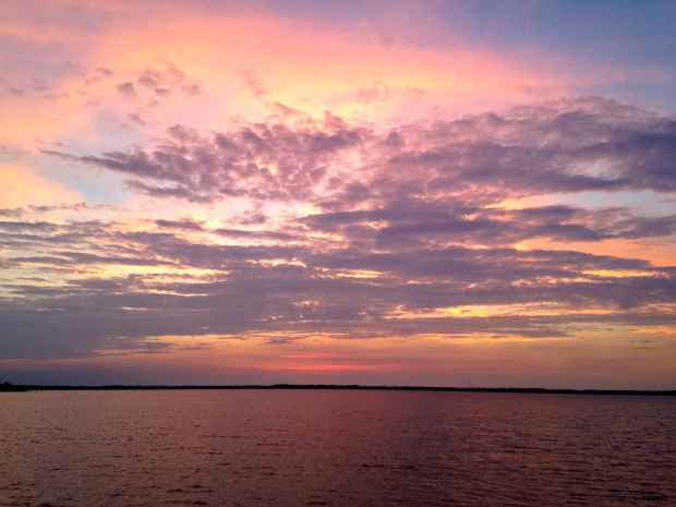 Sunset at the Little Alligator River.  We watched the sunset from the bow, trying to pick up a cell signal to check the weather!