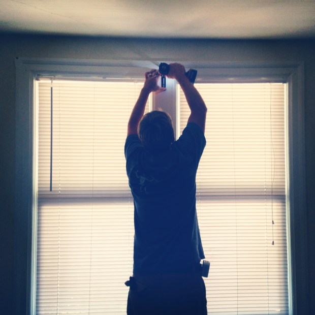 Jake with tools in a house.  One of the many places he belongs <3